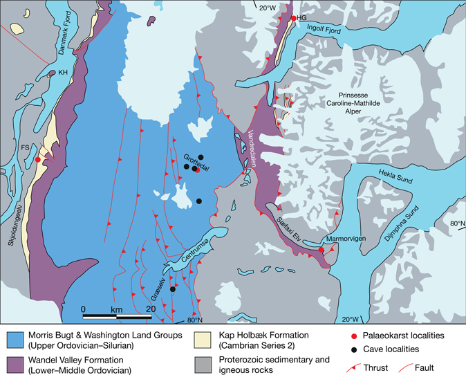 Fig. 2 Geological map of Kronprins Christian Land, North-East Greenland, showing the distribution of Sandbian (Upper Ordovician) to Wenlock (Silurian) shelf limestones in which caves are developed (black dots). A regionally extensive palaeokarst horizon is preserved where Cambrian Series 2 quartz arenites of the Kap Holbæk Formation rest on carbonate units such as the Tonian (lower Neoproterozoic) Fyns Sø Formation (red dots). FS: Fyn Sø. HG: Hjørnegletscher. KH: Kap Holbæk. Linework based on primary field mapping in 1994, 1995, and 2019, together with the 1:500 000 GEUS geological map (Jepsen 2000).