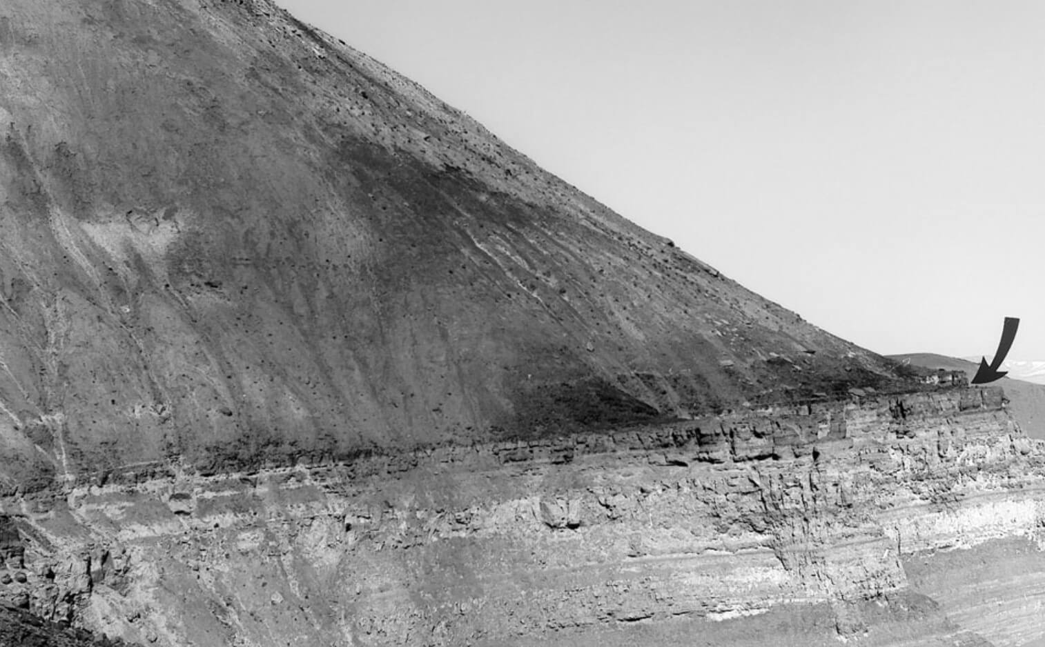 Black and white photo of a geological exposure on a mountain side.