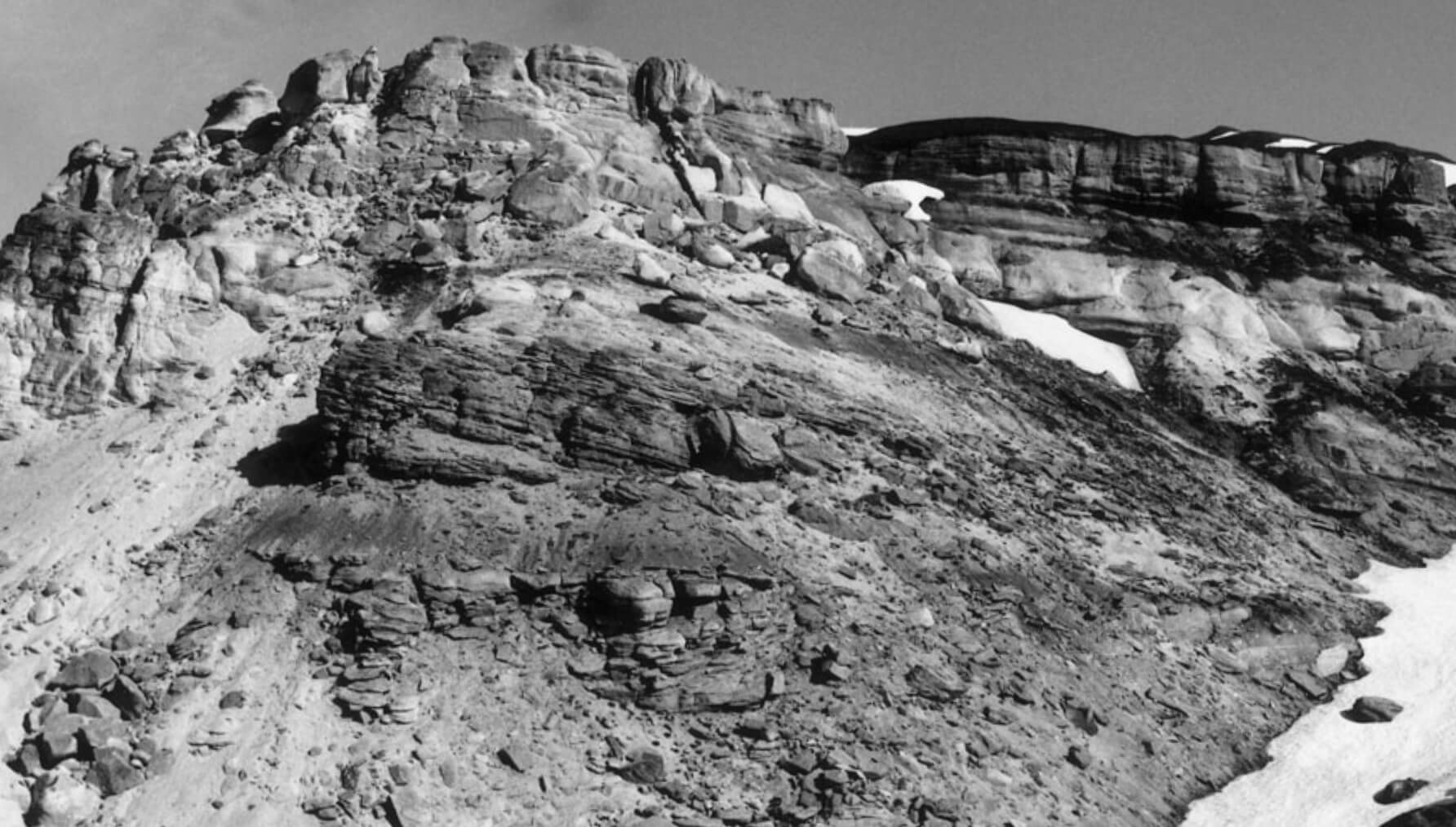 Black and white photo of rocky hillside.