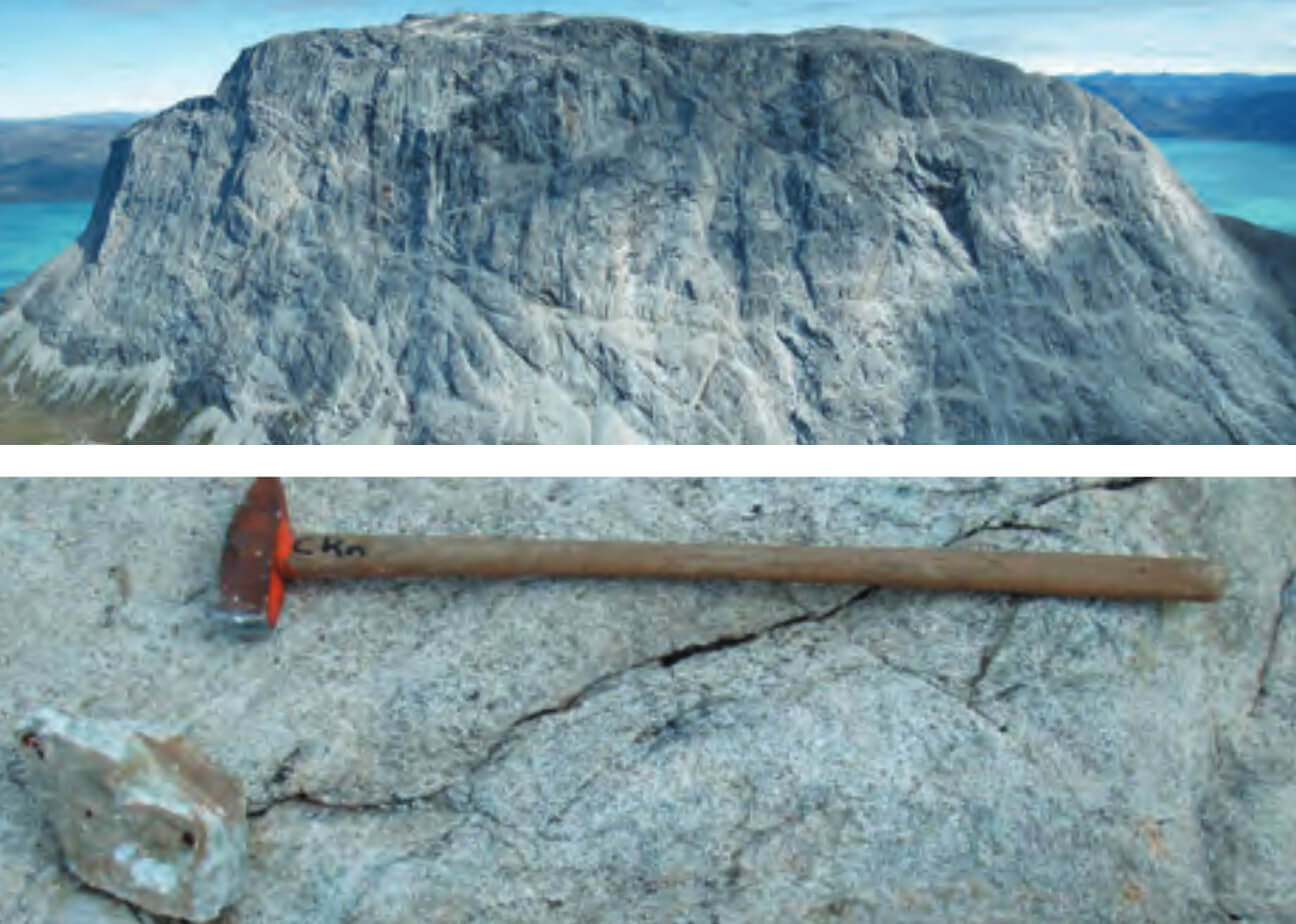 View of Mountains and a close up view of rocks with hammer for scale.