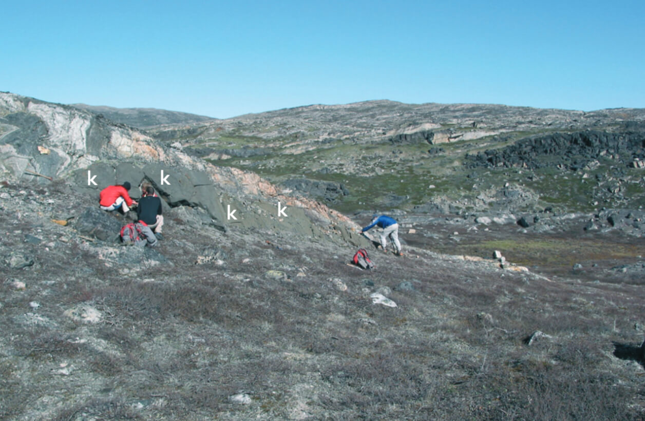 View of the study site with three people at work.