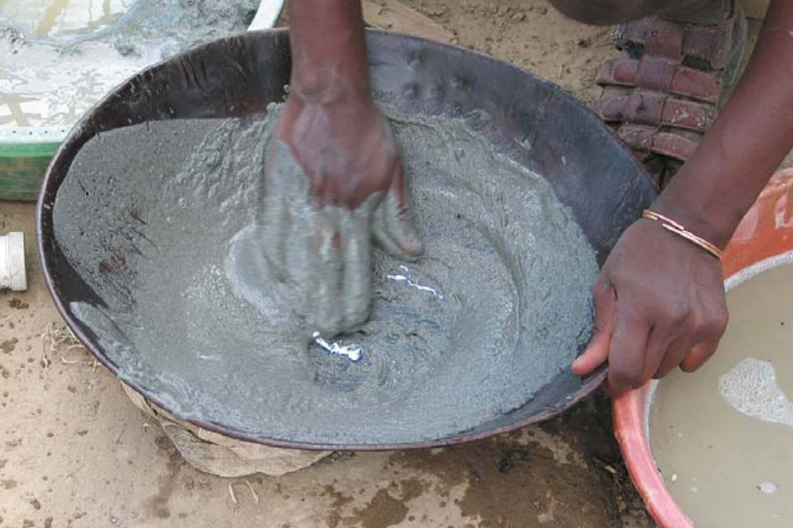 Person mixes sediment in a bowl