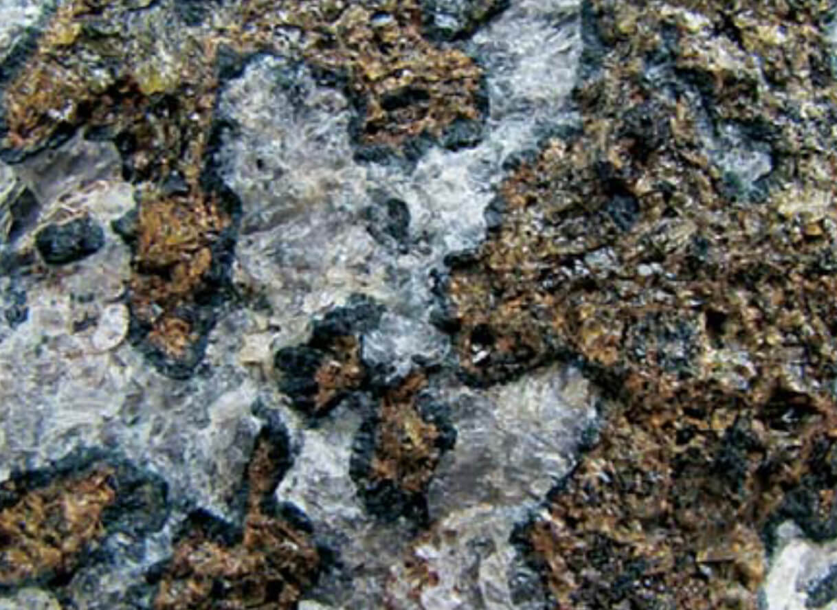 Close up on mineral veins in rock.