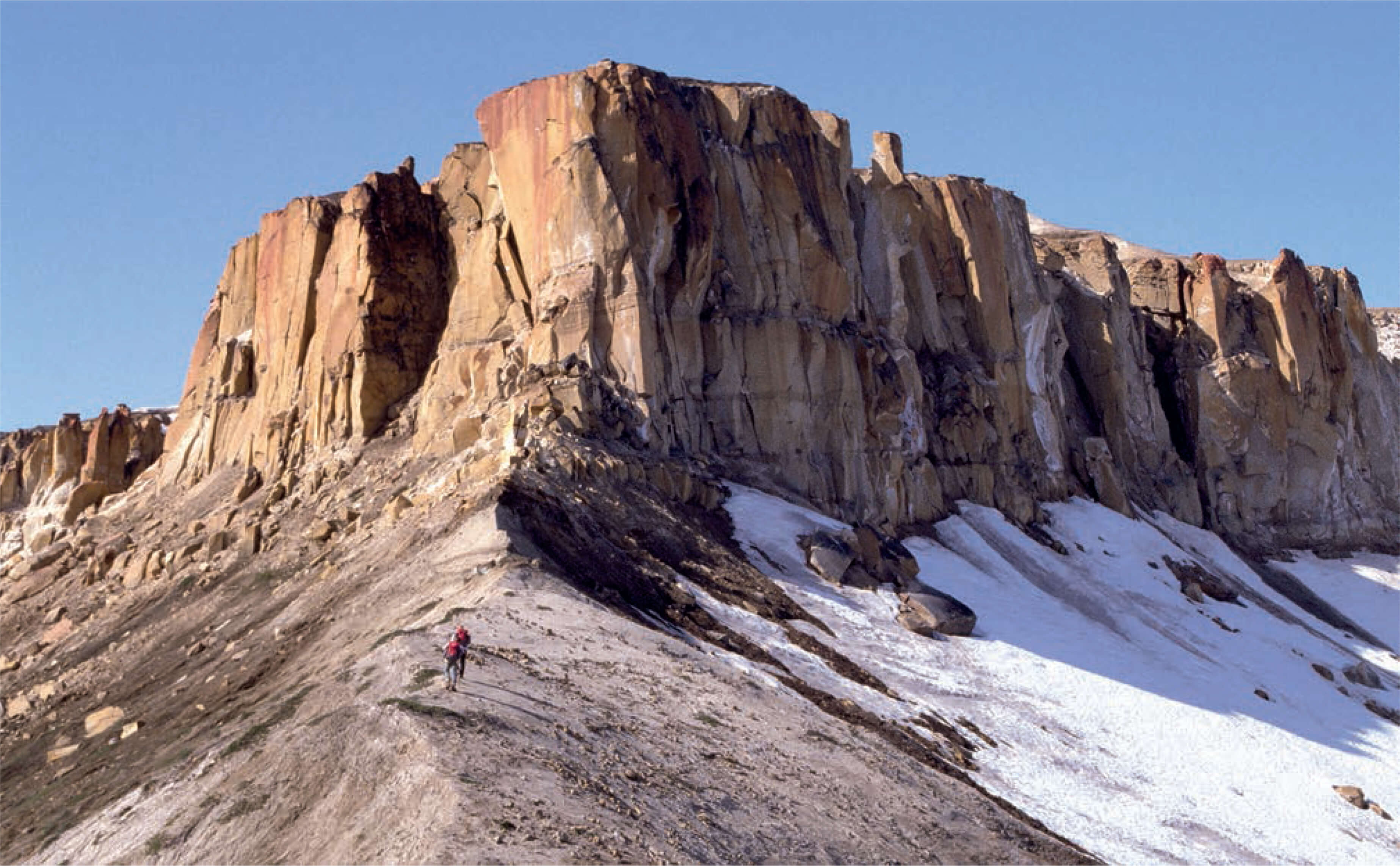 View of people walking up a mountain